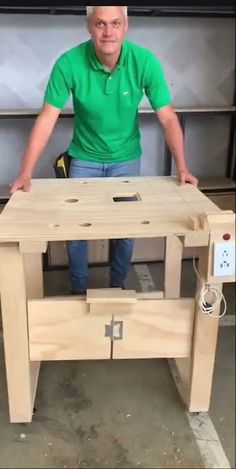 a man sitting at a table made out of wood