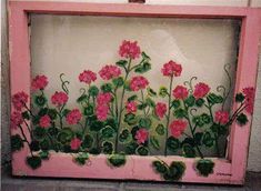 a pink frame with flowers painted on it