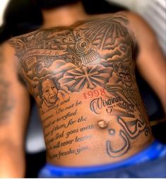 the back of a man's chest with tattoos on it and words written in different languages