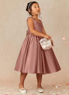 Let your flower girl have fun walking down the aisle while tossing petals in our Matte Satin A-line dress, Cutie Pie. Her square neckline is ruched beautifully and has elastic straps. The back ties into a beautiful bow while the gathered skrit is perfect for twirling an dancing. This dress is not only perfect for a flower girl at a wedding but also versatile enough for other special occasions. Old Rose Dress, Flower Maiden, Kids Bridesmaid Dress, Pink Toddler Dress, Blush Flower Girl Dresses, Girls Bridesmaid Dresses, Ruffle Neck Dress, Fall Bridesmaid Dresses, Pink Flower Girl Dresses