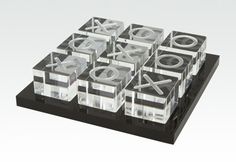 a black and clear display case with various symbols on it's sides, including the letter x