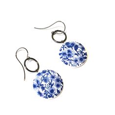 Cobalt blue & white floral statement earrings made with vintage components from the 1970's. Floral pieces meet rings in this retro yet modern combination. Each drop earring measures about 2" in length & 1" in width. Blue Round Spring Jewelry, Blue Round Jewelry For Spring, Round Blue Jewelry For Spring, Retro Blue Earrings For Pierced Ears, Vintage Dangle Earrings For Spring, Retro Blue Drop Earrings, Vintage Blue Drop Earrings Jewelry, Retro Blue Drop Earrings Jewelry, Vintage Blue Drop Earrings