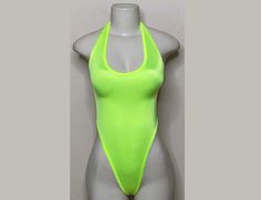 Welcome to my shop Let's Make Money Together 💕 DETAILS  * Handmade Item  * Materials: Spandex * Never used  DESCRIPTION  *  Full Tie Back Thong Bodysuit  *  Neon Yellow Trim * 4 way stretch Fabric  * Mannequin is wearing small only size available  SHIPPING  My current shipping turnaround is really quick 1 to 2 days  RETURNS & EXCHANGES  No refunds or exchanges if you have any issues with your purchase please feel free to reach me personally. I can accommodate on your next order of change a sizi Fitted T-back Swimwear For Club, Fitted T-back Party Leotard, Stretch T-back Swimwear For Club, Stretch T-back Bodysuit For Swimming, High Cut Swimwear For Club And Summer, Summer Nylon Dancewear Bodysuit, Summer Dancewear Nylon Bodysuit, Summer Backless Dancewear Leotard, Summer High-stretch Dancewear Leotard