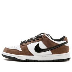 a brown and white nike dunk low sneaker on a white background with black laces