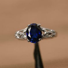 a ring with a blue stone on it