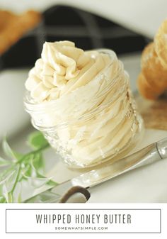 whipped honey butter in a glass jar next to a pair of scissors