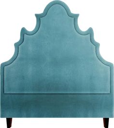 an upholstered headboard with wooden legs and a blue velvet finish on the frame