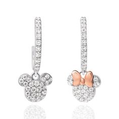 Sparkle in these classic Disney Mickey and Minnie Mouse Mismatched Sterling Silver Hoop Charm Earrings. These charm hoop earrings are embellished with clear cubic zirconia. Mismatched dangling charms feature Minnie Mouse and Mickey Mouse. A rose gold bow adorns the Minnie charm .925 Sterling Silver Officially Licensed Disney Jewelry Includes Complimentary Disney Gift Box Minnie Mouse And Mickey Mouse, Disney Mickey And Minnie, Minnie And Mickey, Mickey And Minnie Mouse, Hoop Charms