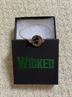 Wicked Broadway merchandise. New in box Two Witches Bangle Bracelet. Item #12804 Wicked Bracelet Ideas, Wicked Bracelet, Wicked Merch, Wicked Funko Pop, Wicked Art Musical, Wicked Broadway, Broadway Wicked, Fun Crafts To Do, Universal Studios Orlando