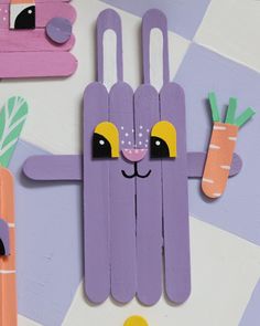 a wooden cutout of a bunny and carrots