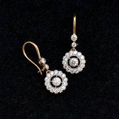 A stunning diamond dangle earrings are a perfect pair for your big day! With over a quarter carat of diamonds, these earrings sport a 0.10ct diamond in the center with a scalloped diamond halo which dangles beautifully from 2 diamonds! The ear wire is comfortable and can be locked for a secure fit! * Diamond Wt. : 0.85 Cts * Color-Clarity Grade : H-I, Vs-Si * Gold - 14K, 3 gms solid gold These earrings come in a lovely gift box with EGL certification. Find us on Instagram for exquisite designs: Fine Jewelry Bridal Drop Earrings With Brilliant Cut, Timeless Diamond Earrings For Wedding, Timeless Diamond Wedding Earrings, Fine Jewelry Dangle Earrings With Single Cut Diamonds, Exquisite Drop Diamond Earrings With Single Cut Diamonds, Exquisite Diamond Dangle Earrings, Exquisite Diamond White Dangle Diamond Earrings, Exquisite Oval Diamond Earrings With Accents, Exquisite Diamond White Dangle Earrings