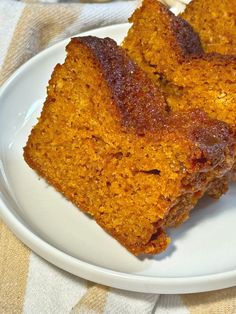 two pieces of cake sitting on top of a white plate