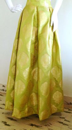 Lime green brocade box pleat skirt Green Pleated A-line Skirt, Elegant Long Yellow Skirt, Green Flared Pleated Skirt, Green A-line Dress With Lined Skirt, Elegant Green A-line Maxi Skirt, Green Long Pleated Skirt, Green A-line Pleated Skirt, Green Flowy Formal Skirt, Formal Green Flowy Skirt