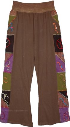 Bring out an inner boho retro look with these fabulous pants, the cotton pants have a unique set of embroidered florals running on the sides- in green, purple, brown etc, which makes them a one-of-a-kind piece. These cotton pants feature a flexible and comfortable yoga waist. #tlb #SplitSkirtsPants #Patchwork #Embroidered #bohemianfashion #Handmade #BohemianPants #FallPants #PatchworkPants #HippieCottonPants Festival Brown Patchwork Bottoms, Hippie Style Brown Bottoms For Spring, Hippie Brown Bottoms For Fall, Hippie Style Cotton Pants For Fall, Hippie Style Brown Bottoms For Festival, Brown Hippie Bottoms For Festival, Hippie Style Brown Festival Bottoms, Bohemian Brown Cotton Pants, Cotton Harem Pants For Fall Festival