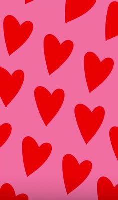 many red hearts on a pink background