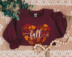 Embrace the cozy vibes of the season with our Halloween/Fall sweatshirt! Crafted from soft, comfortable fabric, this sweatshirt is perfect for celebrating autumn and Halloween. Whether you're pumpkin picking, enjoying a bonfire, or just soaking in the fall festivities, this sweatshirt is a must-have addition to your seasonal wardrobe. ❤With TrendyFoxApparel, our garments are more than just a piece of clothing; they are a canvas for self-expression. Elevate your style and express your individuali Fall Loungewear T-shirt, Red T-shirt For Fall Loungewear, Red T-shirt For Loungewear In Fall, Red Fall Sweatshirt For Loungewear, Red Sweatshirt For Fall Loungewear, Red Cotton Sweatshirt For Fall, Red Sweatshirt For Loungewear In Fall, Cozy Fit Graphic Print Tops For Fall, Cozy Fall Sweater With Graphic Print