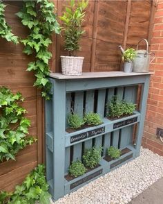 an outdoor shelf with plants growing on it