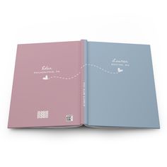 a pink and blue book with a white line going through it