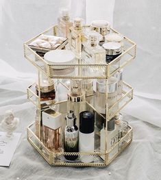 Enhance your cosmetic organization with this elegant and modern makeup organizer featuring a 360-degree rotation for effortless access to all your beauty products. Constructed from premium glass, this durable and sturdy organizer boasts multiple compartments designed to neatly store various cosmetics and perfumes. Its sophisticated design adds a refined touch to your bathroom vanity or dresser, while its functionality ensures your makeup and fragrance collection is organized and always within ar Makeup Organizer Countertop, Rangement Makeup, Makeup Tray, Acrylic Organizer Makeup, Perfume Organization, Neutral Pillows, Perfume Tray, Make Up Organiser, Skincare Organization