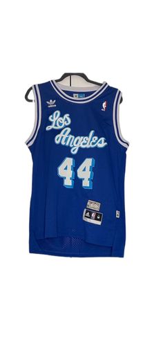 a blue basketball jersey with the number four on it and an inscription that reads los angeles