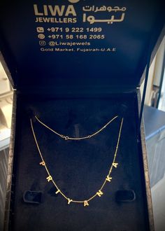 a necklace in a box on display at a jewelry store