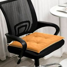 an office chair with a seat cushion on it