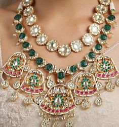 This is a unique set that comes with matching earrings and is in pink and gold finish with beautiful pearl drops. Can be worn on any outfit or for a bridal look as its a complete set of worn for a simple elegant look as well! It's made of high quality stones and kundan and polki work is done with beautiful carved technique. Pink Temple Jewelry Necklace With Latkans, Pink Kundan Temple Necklace For Festivals, Pink Kundan Temple Necklace With Meenakari, Pink Meenakari Kundan Temple Necklace, Traditional Pink Kundan Temple Necklace, Pink Temple Necklace For Wedding And Diwali, Pink Temple Necklace For Wedding And Festive Occasions, Pink Temple Necklace For Festive Wedding, Pink Kundan Jewelry With Intricate Design