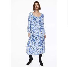 H&M Balloon Sleeve Smocked Blue White Floral Midi Dress. Calf-Length Dress In Woven Fabric. Sweetheart Neckline, A Fitted, Smocked Bodice, And Long Balloon Sleeves. Narrow Elastic At Neckline, Over Shoulders, And At Cuffs. Gently Flared Skirt. Unlined. Fit - Slim Fit Composition - Rayon 88%, Polyamide 12% Blue Long Sleeve Smocked Summer Dress, Blue Long Sleeve Smocked Dress For Summer, Blue Smocked Midi Dress For Daywear, Blue Smocked Dress With Gathered Neckline For Summer, Blue Floral Print Smocked Dress For Spring, Flowy Casual Midi Dress By H&m, Casual Flowy Midi Dress By H&m, Blue Long Sleeve Smocked Dress With Smocked Bodice, Blue Smocked Dress With Floral Print For Day Out