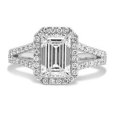 an emerald cut diamond ring with double halos