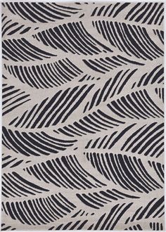 a black and white rug with wavy lines on it