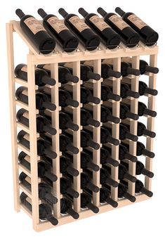 a wooden wine rack filled with lots of bottles on top of eachother in front of a white background