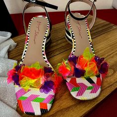 Elevate Your Summer Style With The Kove Sandal By Betsey Johnson. Featuring Vibrant Floral Appliques On A Chic Lucite Strap And A Striped Block Heel, These Sandals Are Perfect For Making A Statement. The Faux Leather Upper And Adjustable Ankle Strap Ensure A Secure And Comfortable Fit, While The Lightly Padded Footbed Keeps You Cushioned All Day Long. With A 2½" Covered Block Heel And A Rubber Sole, These Sandals Offer Both Flair And Functionality. Imported From A Smoke And Pet-Free Home, They'r Spring Multicolor Heels, Multicolor Flat Heel Heels For Spring, Multicolor Low Heel Sandals For Spring, Spring Multicolor Sandals With Low Heel, Spring Multicolor Low Heel Sandals, Chic Multicolor Spring Sandals, Black Fabric Heels For Summer, Summer Party Fabric Heels, Spring Fabric Heels