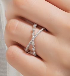 This 14k gold diamond stacking criss cross ring has round prong-set diamonds on two connected rings. Sparkles with every movement. You can also use it as a stacking or wedding band. Each piece is accompanied by an Azalea Certification and Warranty document, ensuring that you receive a high-quality, authentic piece of fine jewelry. Please message us if you don't receive your certification with your piece. This piece also comes with free engraving! M A T E R I A L & L E N G T H Available in 14k Yellow Gold, 14k Rose Gold, 14k White Gold, 18k Yellow Gold, 18k Rose Gold, 18k White Gold and Platinum. Please message us for 18k gold and Platinum prices. Band width:  12 mm Stone: Natural Diamonds Diamond sizes: 1 mm and 1.5 mm Carat Weight:   0.35 ct. tw. Color: G Quality: SI-VS Additional Notes: Diamond Cross Ring With Diamond Accents For Promise, Promise Ring With Cross Shaped Diamond Accents, Elegant Diamond Cross Ring, Elegant Cross-shaped Diamond Rings, Diamond Accented Cross Promise Ring, Cross Shaped Promise Ring With Diamond Accents, Cross-shaped Promise Ring With Diamond Accents, Cross Ring With Diamond Accents For Promise, Elegant Cross-shaped White Gold Ring