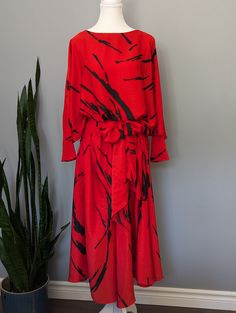 **Made in Canada** Disco glam! Check out this bright, flowy party dress circa the 1970's. Can you picture wearing this to a retro dinner party or event? Bow can be tied in front or back.  Excellent condition, no stains or damage. Tag says size 14. Please remember to take your measurements. Vintage sizing may vary greatly! Chest: 38" Waist: 38" Sleeve length: 23" Length: 48" Sweep/Hem: 160" Silk Party Maxi Dress With Tie Waist, Fall Party Flowy Maxi Dress, Party Maxi Dress With Tie Waist, Luxury Maxi Dress With Tie Waist For Party, Flowy Tie Waist Party Dresses, Fall Evening Maxi Dress With Tie Waist, Spring Party Maxi Dress With Tie Waist, Flowy Tie Waist Maxi Dress For Evening, Flowy Tie Waist Midi Dress For Party