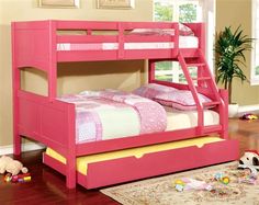 a pink bunk bed sitting on top of a wooden floor