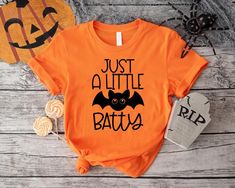 Just A Little Batty Shirt,Halloween Bat Shirt, Halloween Gift,Funny Halloween Shirt,Spooky Bat Shirt,Spooky Season Shirt,Halloween Party Tee ----- How To Order ----- 1-) Please, check and review all the photos. 2-) Choose your t-shirt size and color. *Different styles of shirts may have different shades of same color choice due to different manufacturer brands. *For this reason, we recommend you to match shirts from the same styles if you want precisely matching colors (ex. Unisex, V-necks, Todd Halloween Novelty Shirt With Letter Print, Novelty Halloween Shirt With Letter Print, Casual Halloween Shirt For Costume Party, Casual Halloween Costume Party Shirt, Bat Shirt, Halloween Shirts Kids, Halloween Clothes, Halloween Party Outfits, Bat Halloween