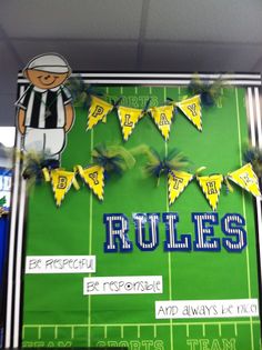 a bulletin board with football rules on it in the middle of a school's classroom