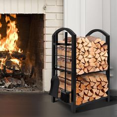 a fireplace with firewood stacked in front of it and a stack of logs next to it