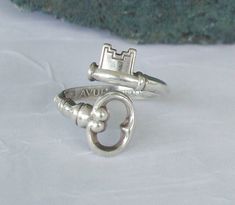 This is a vintage signed AVON Sterling, Skeleton Key, Spoon Ring. It appears in excellent vintage condition, and will fit a size 7 to 9 size ring finger, but it is easily movable, to fit several more sizes up or down. I personally own one of these, and if you have ever wanted a thumb ring, this is a great ring to do this. Your ring will come to you in a beautiful gift box. I do combine on shipping. Note: The spoon rings I offer here on Etsy are not reproductions. They are from the original manufacturer.  Big Note: I have seen my picture of this ring being used by others across the internet. Be AWARE that this is NOT me. I only use dmfsparkles as a user name. I own the name across the internet. If you buy this ring from someone else it may not look like the ring you see here. I did the phot Collar Hippie, Vintage Skeleton Keys, Skeleton Keys, Antique Keys, Spoon Rings, Key To My Heart, Skeleton Key, Pretty Jewellery, Bling Bling