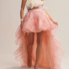 Never Not Making An Entrance In The New Tola Skirt In An Ethereal Biscayne Printed Organza. Below A Fixed Waistband, The Skirt Falls To An Exaggerated, High-Low Fantasy. This Voluminous Skirt Features Endless Arrays Of Dreamy, Pink Tulle Adorned On Layers Of Ruffles. Shown Here In Coral Romance. High Low Skirt Drawing, Big Skirt Sewing Pattern, Short Front Long Back Skirt, Flounce Skirt Pattern, Ruffle Skirt Long, Junk Kouture, Long Pink Skirt, Chiffon Mini Skirt, Rara Skirt