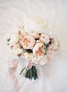 a bridal bouquet with pink and white flowers