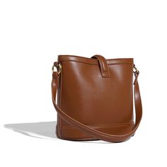 This bucket bag is crafted from soft PU leather in a timeless silhouette that'll work for every day. With double straps, you can wear it in different ways and it's spacious enough for all your essentials. This tan brown shade is perfect for styling with knitwear and printed dresses this year.Weight: 720 gWidth (cm): 15 cmHeight (cm): 22.5 Color: CoffeeStrap Length: 53 cmInterior Material: PolyesterMaterial_bag: PU LeatherBagType: Handbag & Crossbody bagBag Length: 24 cm Printed Dresses, Brown Shades, Leather Bucket Bag, Leather Bucket, Online Bags, High Quality Leather, Tan Brown, Quality Jewelry, Cross Body Handbags