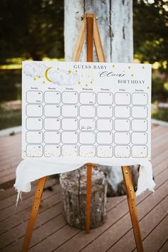 a wooden easel with a sign that says guest baby jack's birthday on it