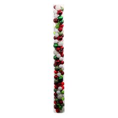 a tall white pillar decorated with christmas balls and bauble decorations on it's side