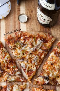 several slices of pizza sitting on top of a wooden cutting board