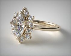 an engagement ring with three pear shaped diamonds