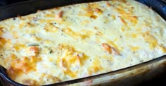 a casserole dish with cheese and chicken in it