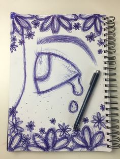 a drawing of an eye with flowers and leaves around it