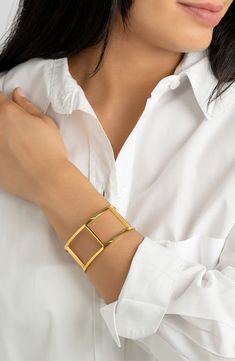 Keep your look classic with a polished bangle bracelet complete with 14-karat-gold plating. 2.5" width Water-resistant 14k-gold plate stainless steel
 Imported Modern Gold-tone Gold Plated Cuff Bracelet, Gold-tone Tarnish Resistant Cuff Bangle, Tarnish Resistant Gold-tone Bangle Cuff Bracelet, Tarnish Resistant Gold-tone Cuff Bangle, Adjustable Gold-tone Classic Cuff Bracelet, Classic Adjustable Gold-tone Cuff Bracelet, Modern Gold Cuff Bracelet With Jubilee Design, Modern Gold Bangle With Jubilee Bracelet, Modern Gold-tone Cuff Bracelet As Gift