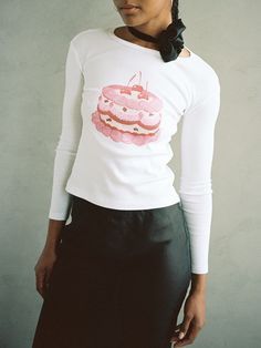 🍰Gah! The Dana is our newest closet staple. A fitted cotton long sleeve tee with a cropped body and the sweetest cake print at the chest. Made from deadstock rib fabric sourced locally in LA. Details 100% Cotton, fabric made in LAMachine wash cold, tumble dry lowMade in California Model wears size SModel's height and bust: 5'8" 32" Size Bust Total Length Sleeve Length XS 28-32" 18" 19" S 30-34" 19" 20" M 32-36" 20" 21" L 36-40" 20" 21" XL 38-42" 21" 22" 2XL 40-44" 21" 22" 3XL 42-46 22" 23" Fitted Sweet Top With Graphic Print, Sweet Long Sleeve Graphic Print Top, Sweet Long Sleeve Tops With Graphic Print, Rosette Choker, Velvet Necklace, Eclectic Aesthetic, Choker Silver, Cake Printing, Rib Fabric